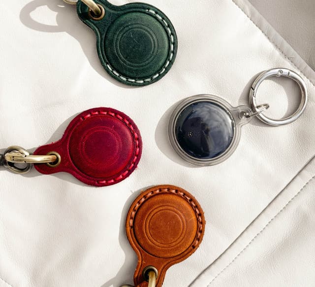 Black Smart Tag with three leather cases