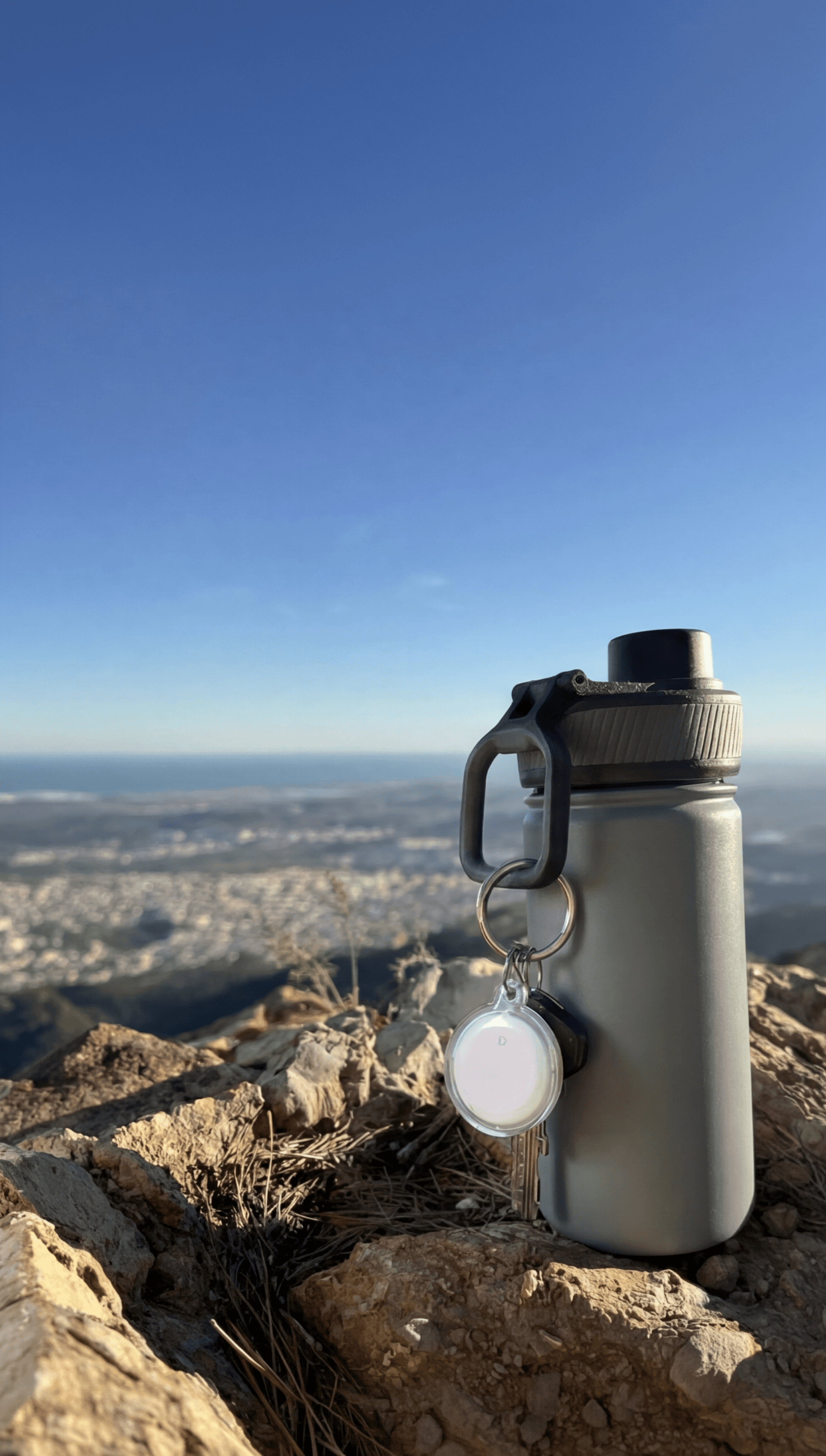 Smart Tag on water bottle in the mountains