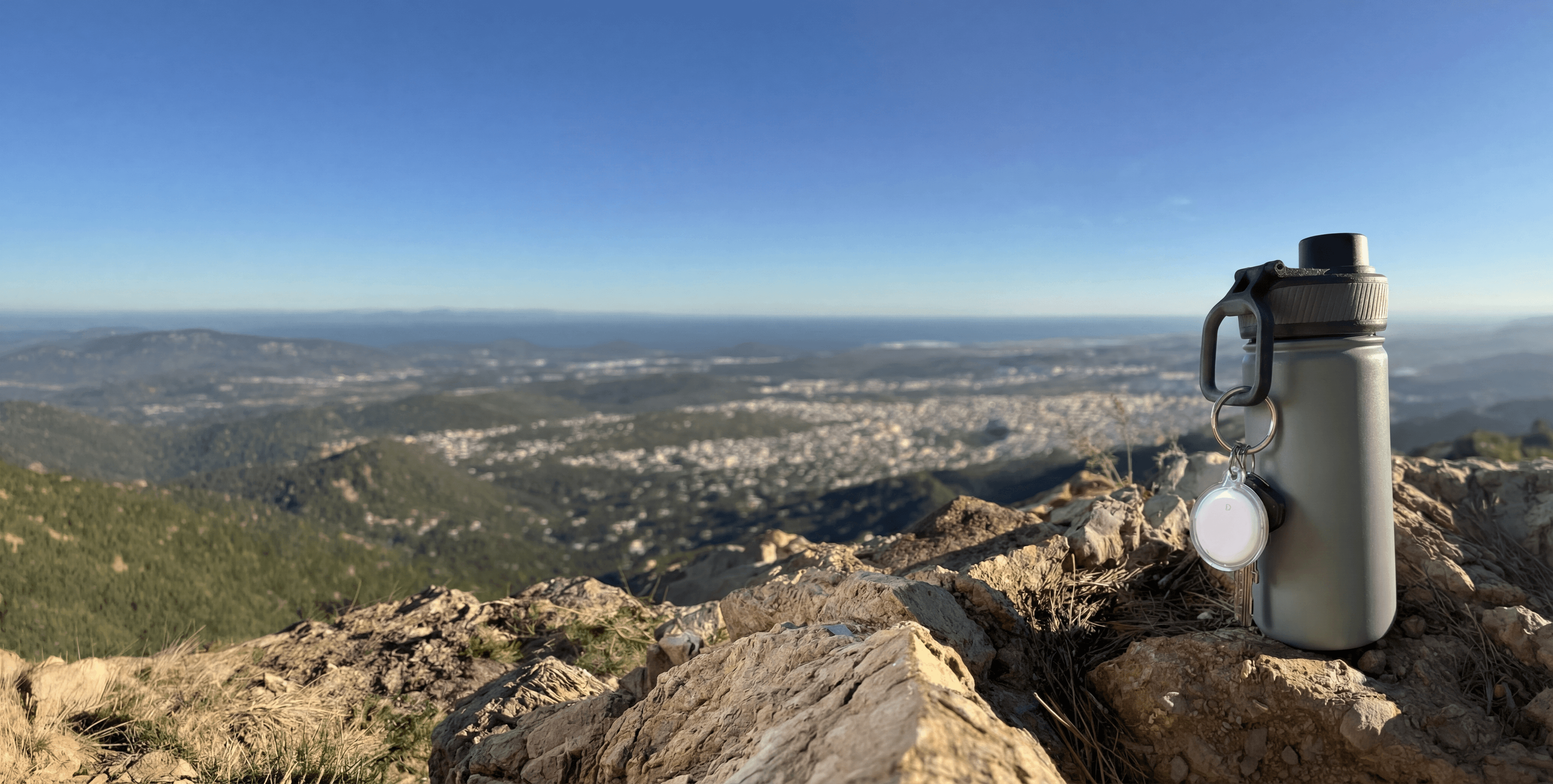 Smart Tag on water bottle in the mountains