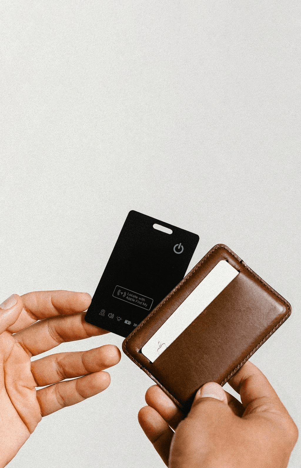 Tracking card in wallet held in hands