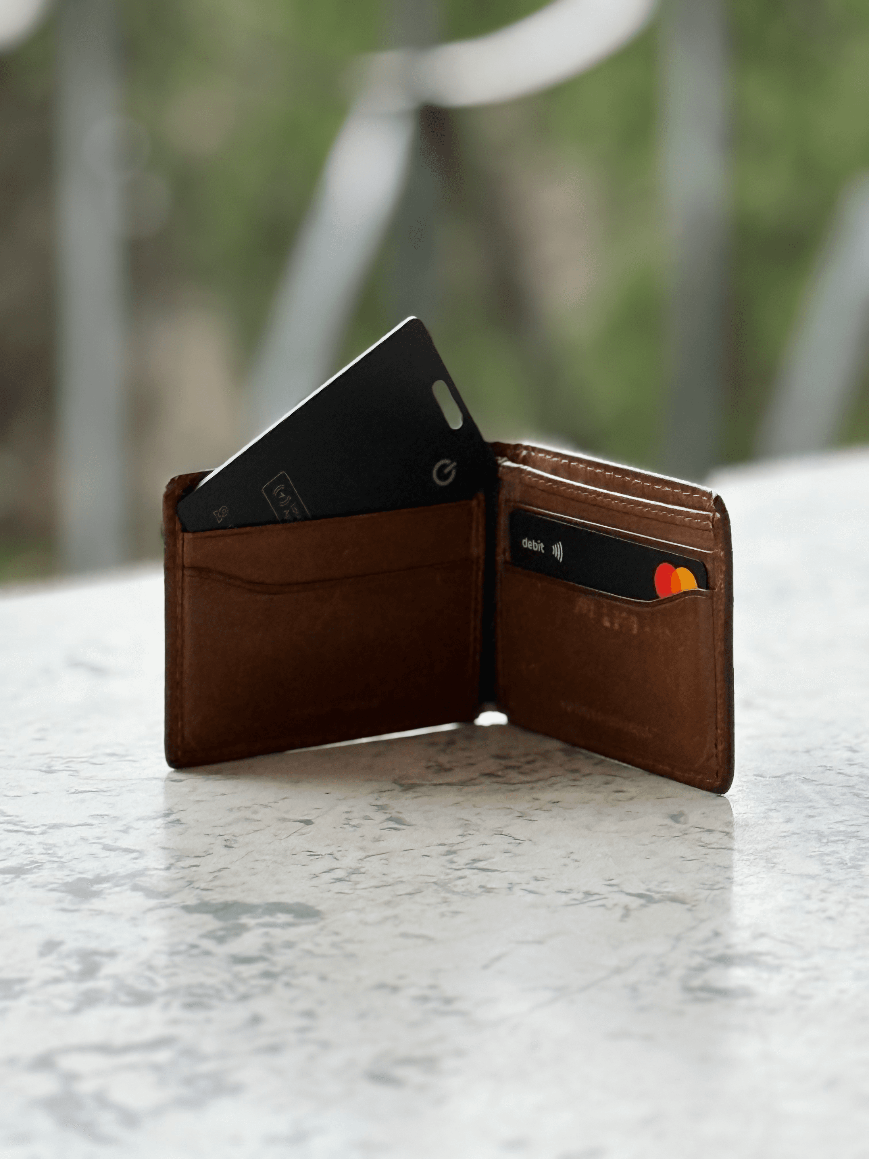 Tracking card next to a wallet
